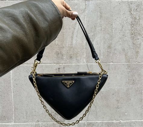 gold triangle prada bag|prada symbole bag.